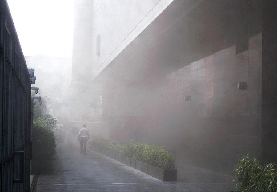 Smoke had reduced the visibility in the passage beside the mall