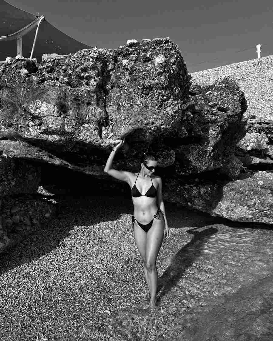 Standing under a cliff, the Qala actress flaunted her toned body. A sleek bun kept her breezy summer look fuss free.  