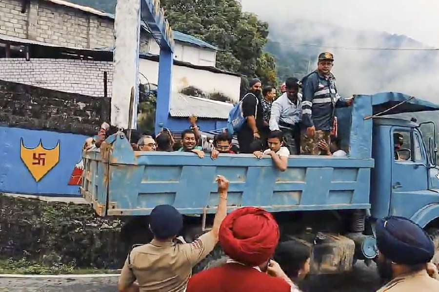 BRO personnel evacuate tourists stranded due to landslides, in Mangan district on June 18, 2023