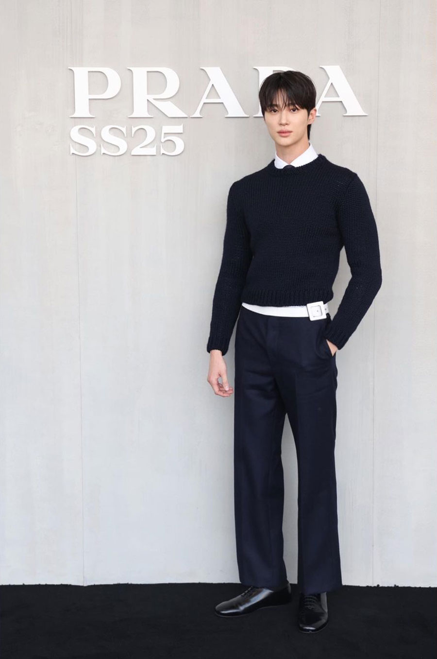 Woo Seok Byeon, who has been winning hearts with his latest K-drama Lovely Runner, stole the spotlight at the Prada Spring Summer 2025 show in Milan. He sported a cosy navy blue sweater with a ribbed appearance and a cropped waist. A white shirt and blue straight pants completed his look.