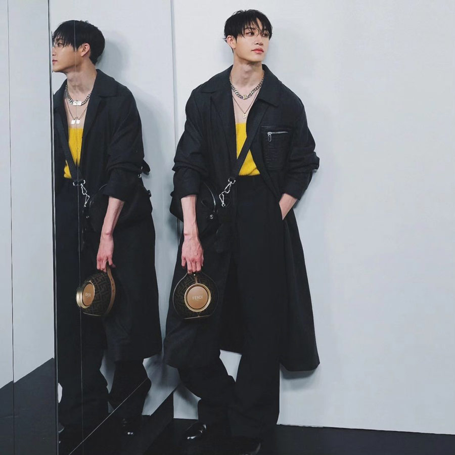 Korean boy band Stray Kids’ lead member Bang Chan made his Milan Fashion Week debut as he headlined Fendi's Spring/Summer 2025 menswear collection. Chan’s chic look included a long black trench coat over a yellow shirt paired with black tailored pants. 