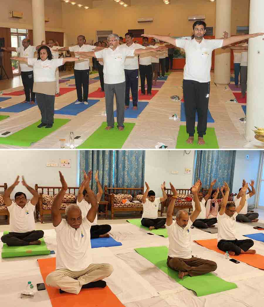 (Top) Eastern Railway general manager Milind Deouskar, along with other staff and officers, practise yoga at Eastern Railway headquarters on Friday and (above) Metro Railway general manager P Uday Kumar Reddy and other senior officials lead KMRC employees at another session on International Day of Yoga at Metro Railway Bhavan