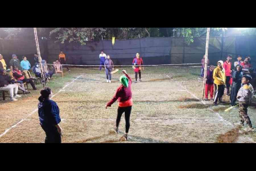 Players on the badminton court in AJ Block