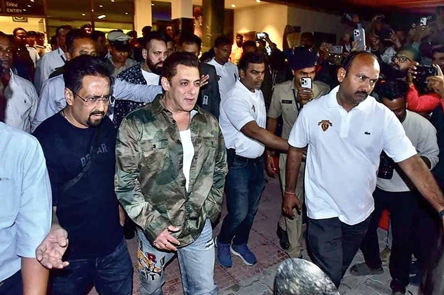 Salman Khan was nattily dressed in a green camouflage print jacket, which he paired with a white t-shirt and blue jeans.  