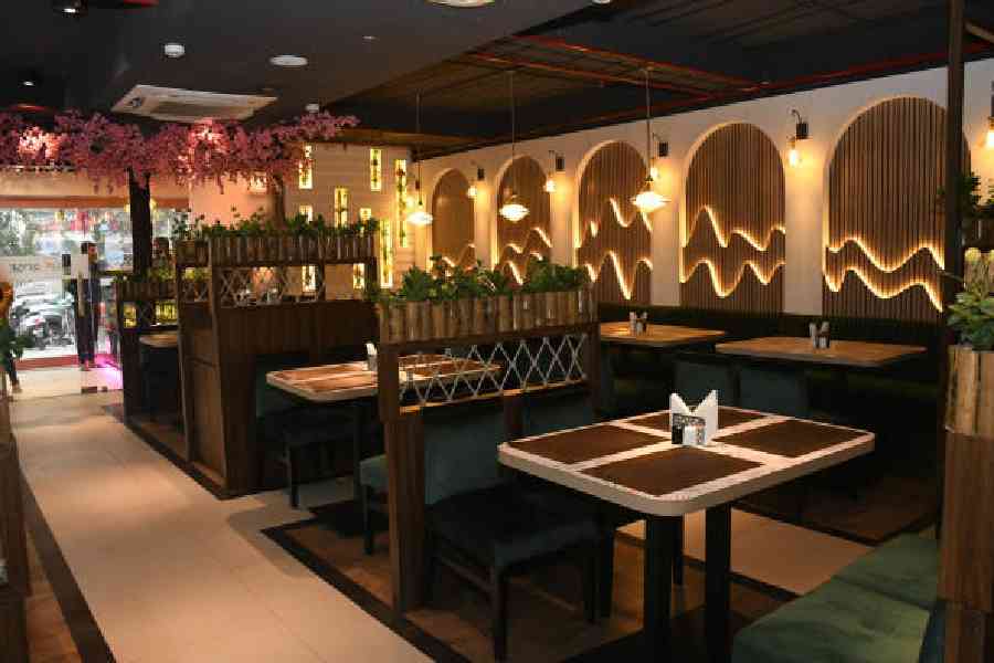 The revamped interiors focus on nature with some greenery around. It features abstract designs on the walls and earthy brown interiors for a harmonious dining experience. The touch of bamboo and plants add to the natural vibe of the place. 