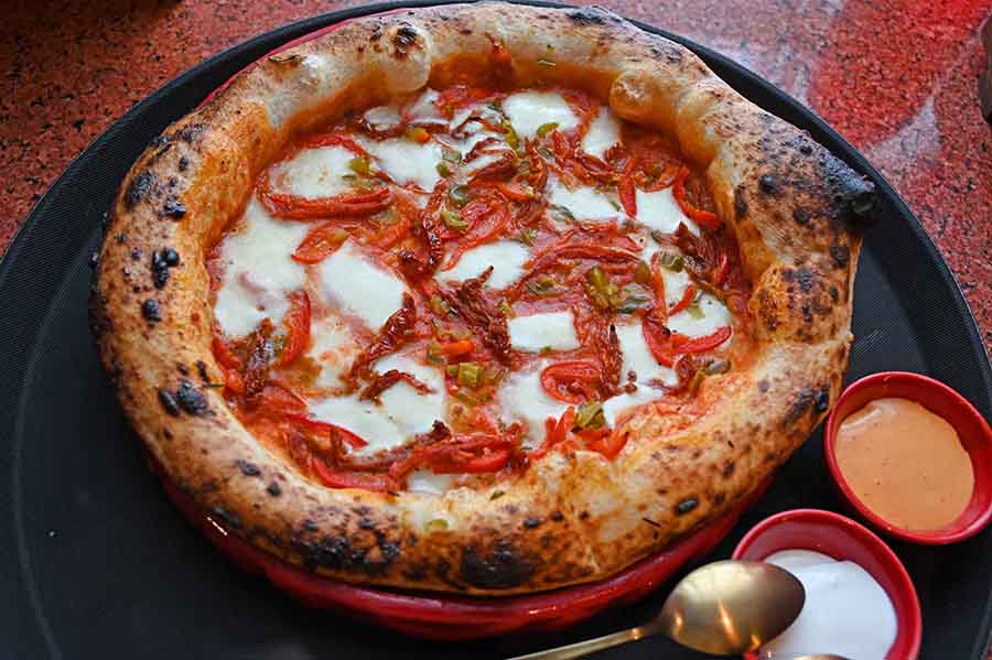 Try the Pepe Picante Pizza which has tangy toppings like San Marzano tomato, mozzarella, sundried tomato, jalapeno, red bell pepper and red chilli