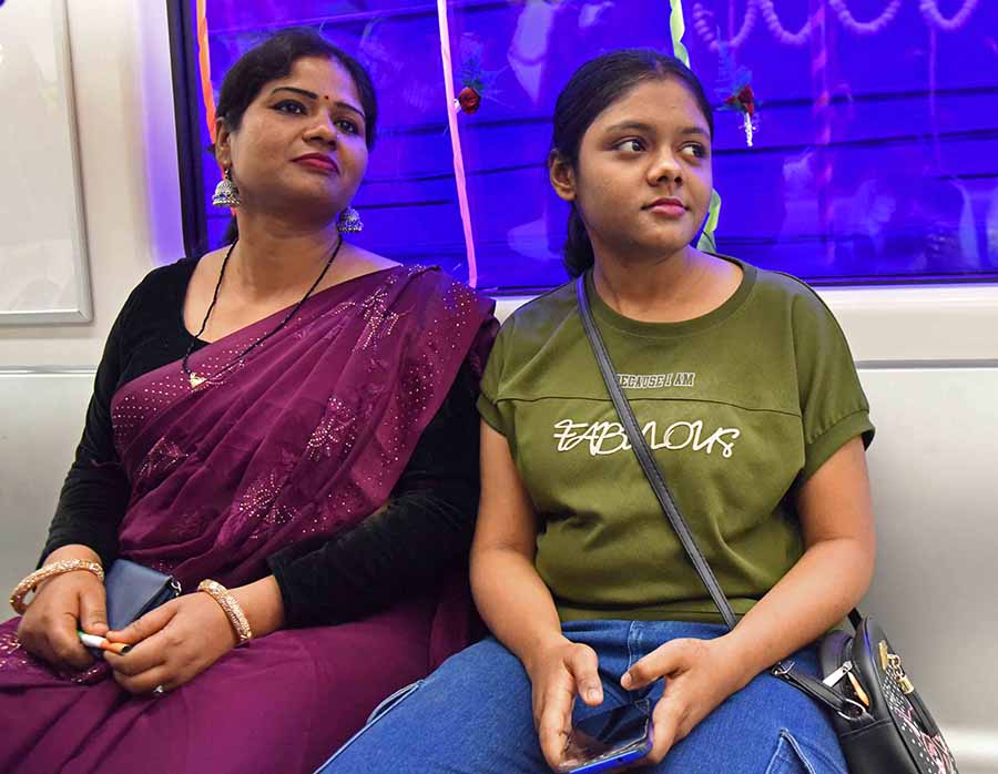 A mother and daughter preferred to sit back and enjoy the experience, instead of holding mobiles in hand, as the Metro crossed the Hooghly. The blue lights in the tunnel implied that the rake was passing the 520-metre undewater stretch 