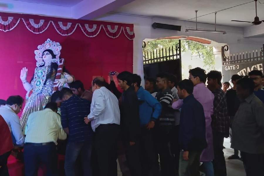The idol of Goddess Saraswati is being brought to school by the students