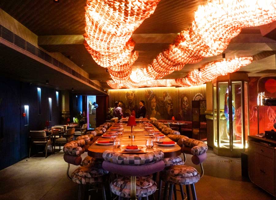 Located on the sixth floor of Celica Park, the new Bombastic Supper Club by Ambuja Neotia has a modern Japanese take in terms of decor and ambience. The sprawling 7,000 sq ft space is divided into booths, private sections, a smoking zone and a private room. Above, one of the most striking decor elements is the red origami trail across the ceiling that represents a traditional dragon puppet used in dances