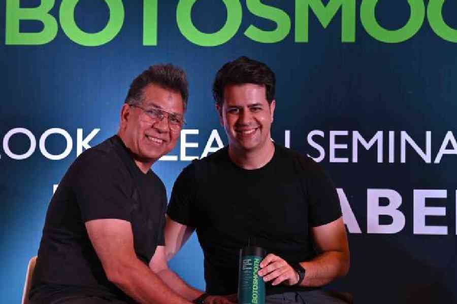 (L-R) Najeeb Ur Rehman and Filipe Rabelo posed with the Botosmooth bottle launched by Godrej Professional