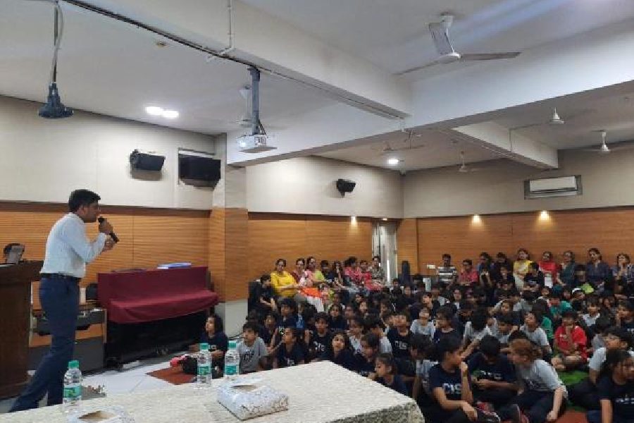 A police officer conducts the session on cyber safety at Calcutta International School on Friday