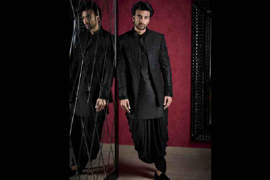Meezaan looked dapper in a raven black silk kurta worn with a jersey dhoti and silk jacket embroidered with micro French knots and beadwork