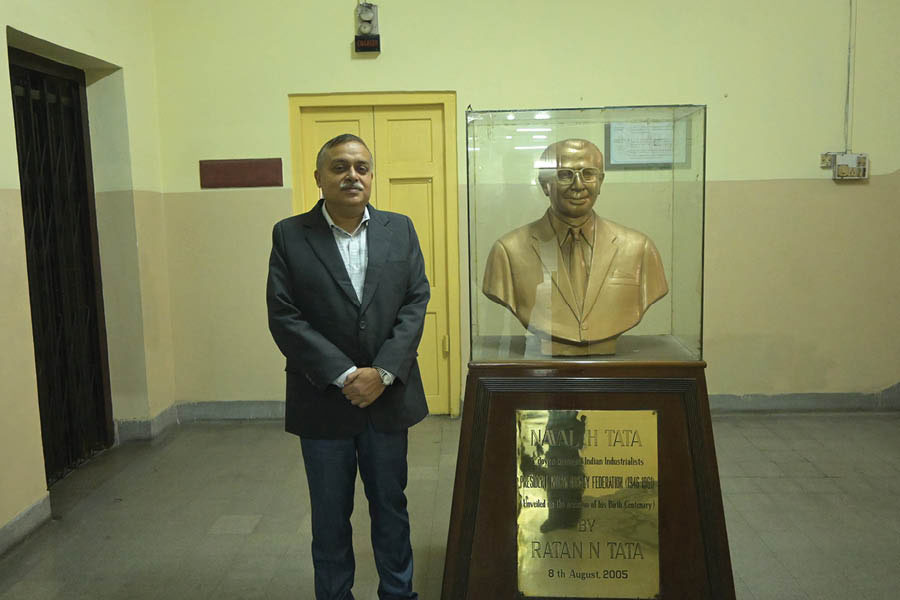 Ghosh with a bust of Naval Tata, which was inaugurated by Ratan Tata in August 2005