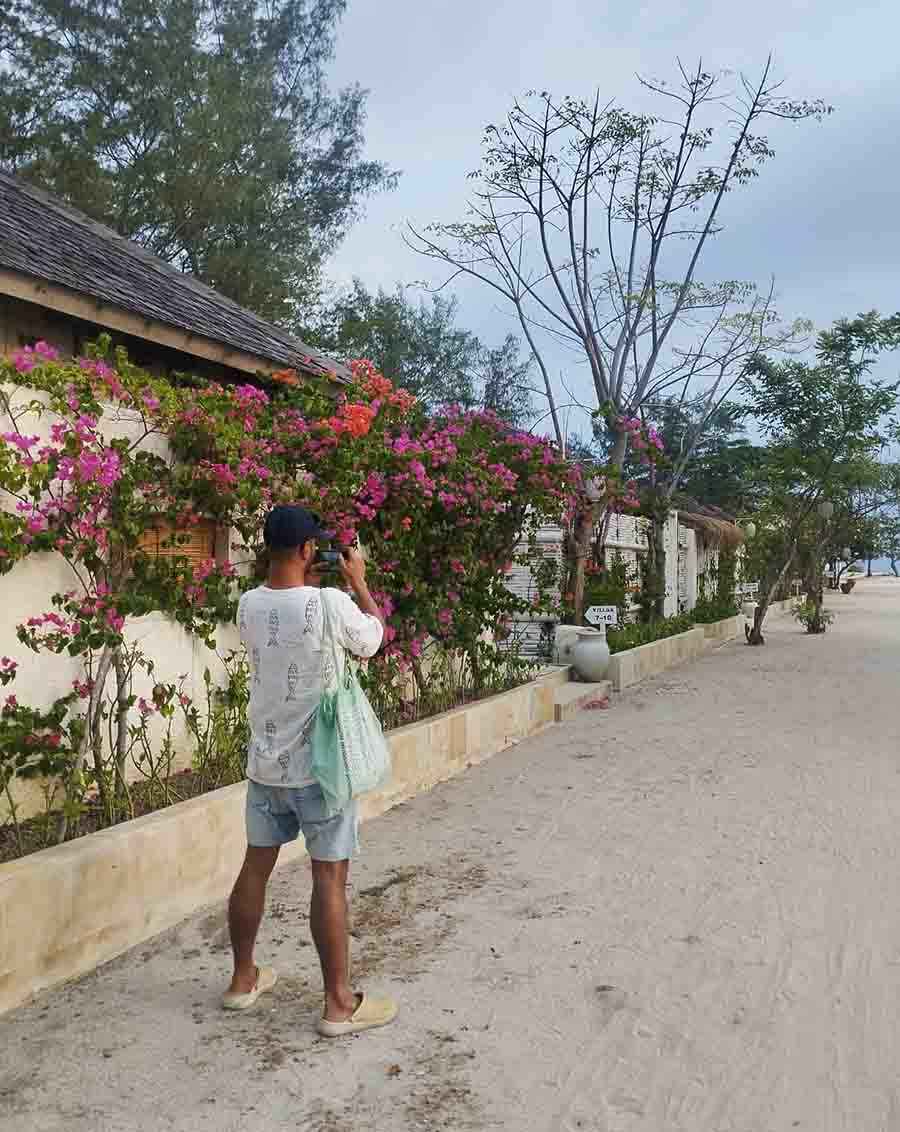 Me clicking pictures of bougainvillea on Gili Meno