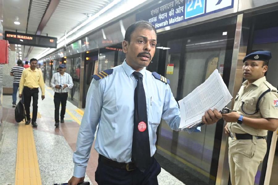 The motorman of the first Metro train on the Esplanade-Howrah Maidan stretch of the east-west corridor at the Esplanade station on Friday morning. He said advanced technical knowledge was required to operate these trains.