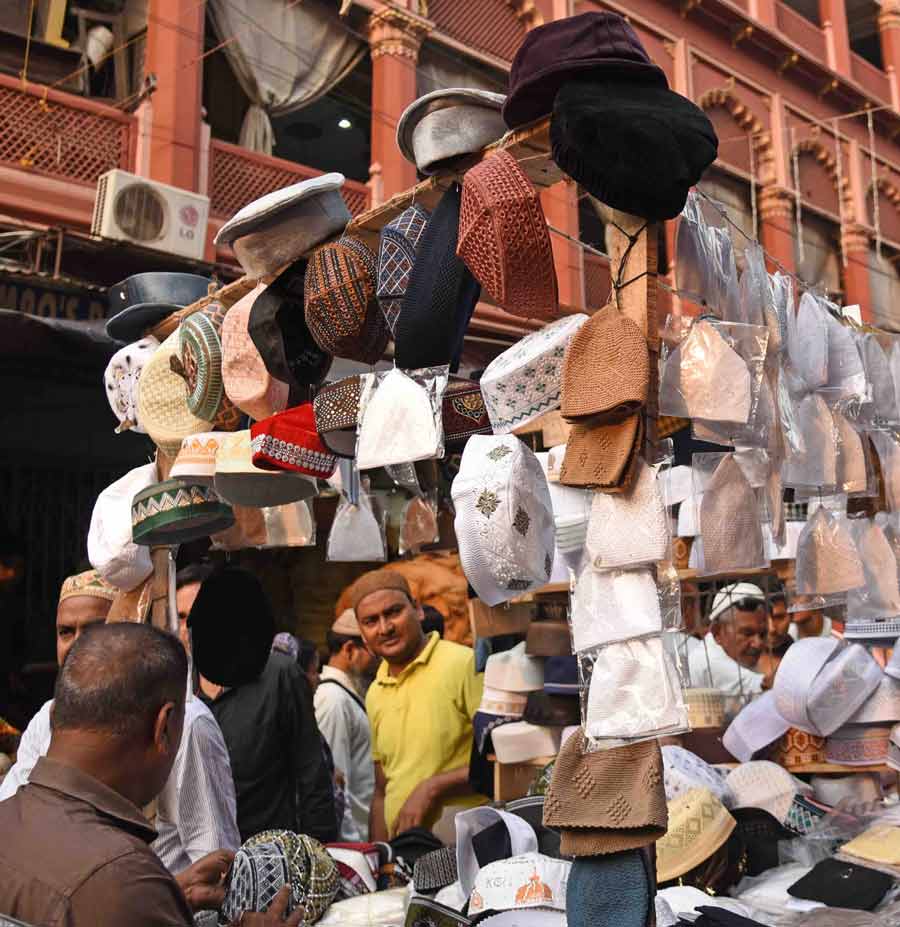 Skull caps of different designs are being sold in front of Nakhoda Masjid ahead of Eid-ul-Fitr  