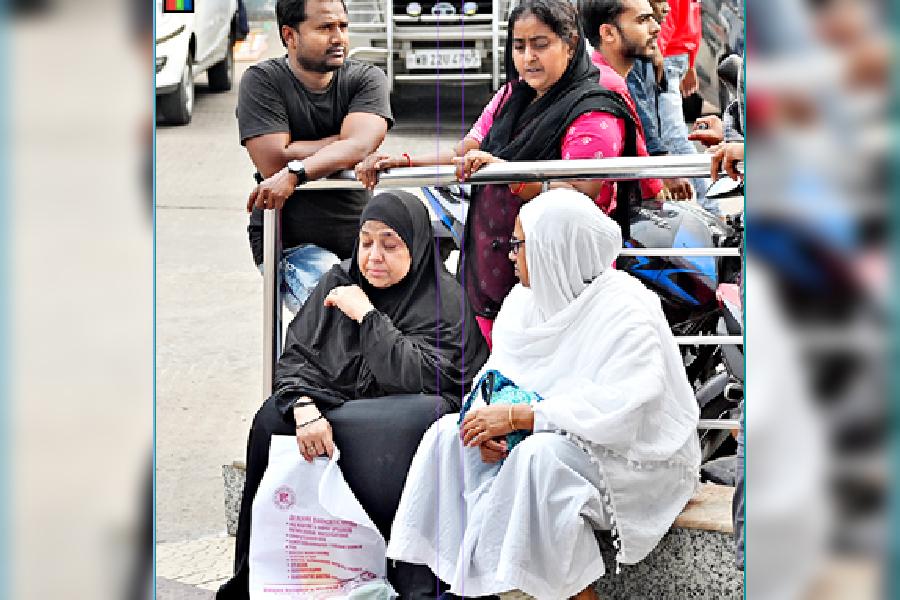 Relatives of some of the injured wait outside SSKM:1 Hospital on Monday.