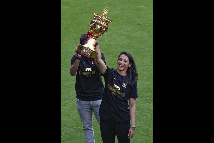 Smriti Mandhana with the Women’s Premier League trophy at the Chinnaswamy on Tuesday.