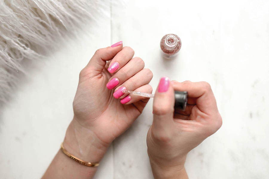Apply a fresh coat of coloured or transparent nail paint to protect them from getting stained