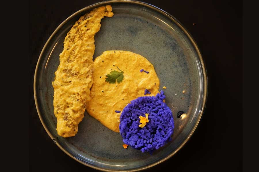 Pabda fish cooked in Marigold Coconut Cream and Purple Karpurkanti rice