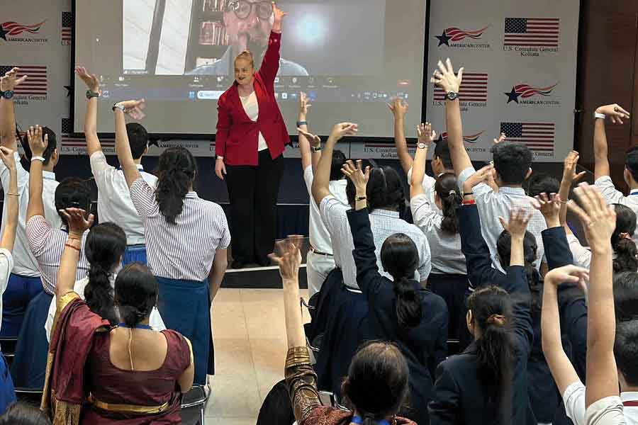 Students take part in an activity led by American Center director Elizabeth Lee during the inaugural event of the US-India Poem Project.