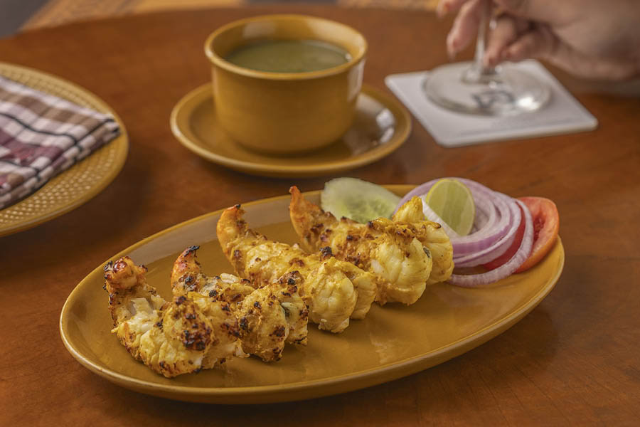 Tandoori Jhinga — fist-size chargrilled prawns that are soft as down pillows