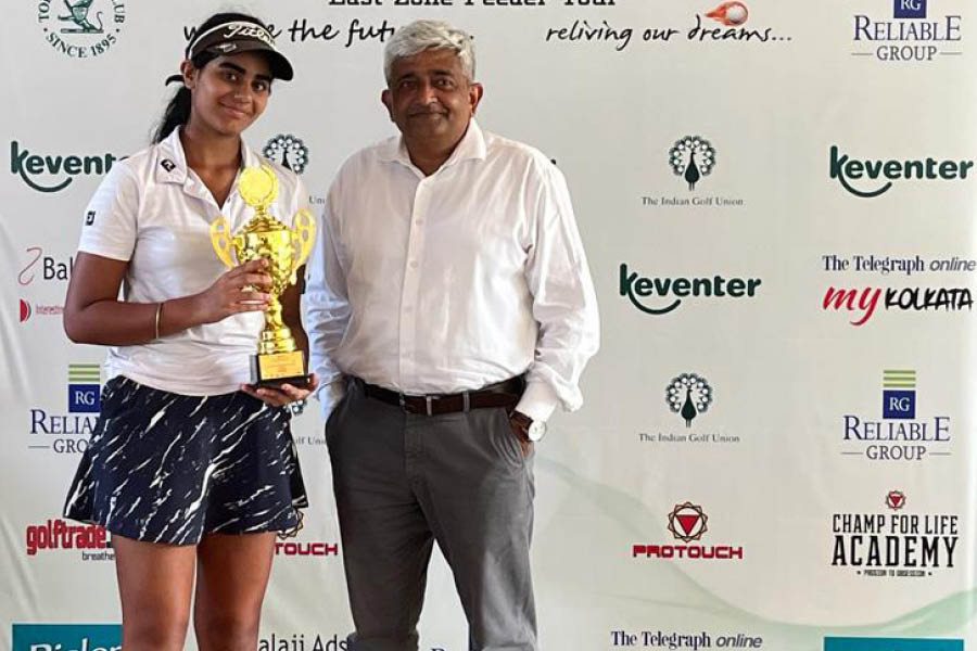Anaahat Bindra (left) collects her trophy from H Brig Ganapathy.
