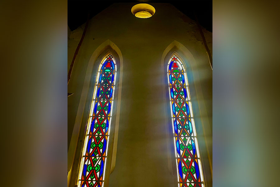 Light streams in through the stained glass