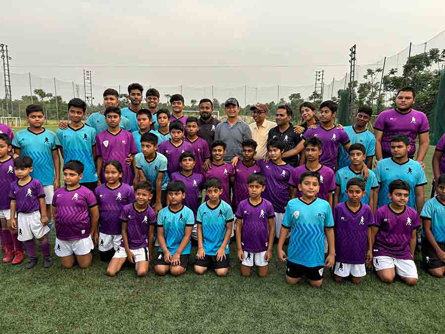 Bhaichung Bhutia with students of R10 Football Academy, a collaboration between former Brazilian footballer Ronaldinho Gaucho and the Merlin Group to nurture football talent in Bengal, at Merlin Rise in Rajarhat. The former India striker inspected the club pavilion’s facilities and shared tips with the students