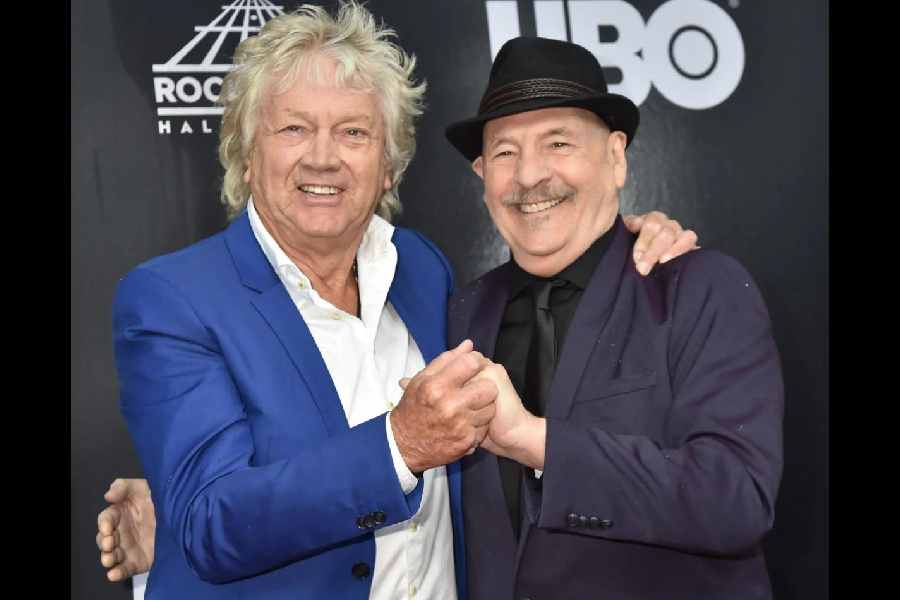 Mike Pinder (right) in 2018 with his former Moody Blues bandmate John Lodge at the Rock & Roll Hall of Fame induction ceremony in Cleveland. The band was inducted nearly 30 years after it first became eligible