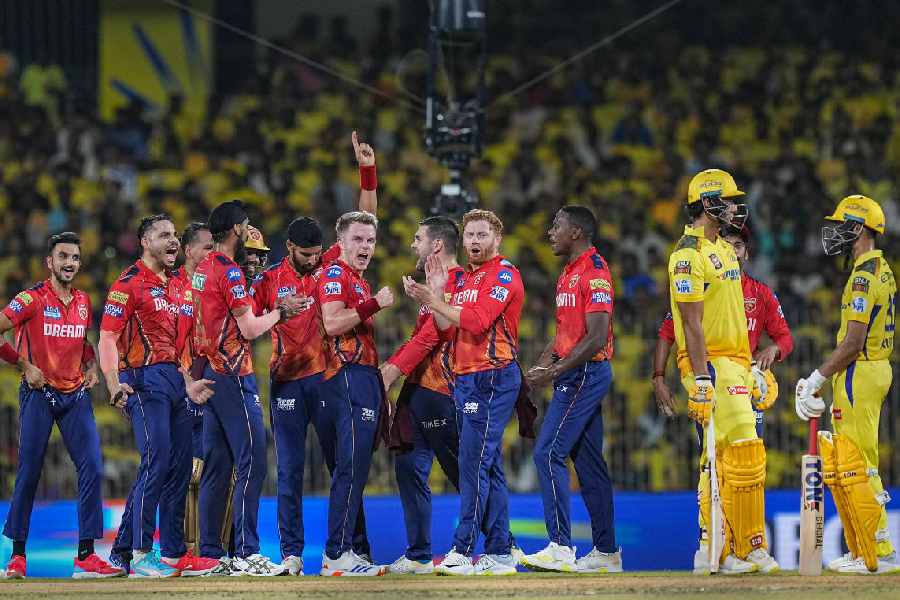 Punjab Kings bowler Harpreet Brar (hand raised) celebrates with teammates after dismissing Chennai Super Kings batter Shivam Dube (second from right) during the IPL match at MA Chidambaram Stadium in Chennai on Wednesday.