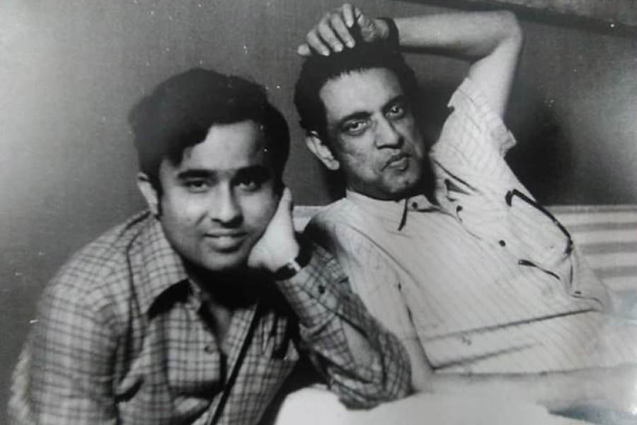 A young Anup Ghosal with Satyajit Ray in a photograph hung from the walls of his living room at his Gariahat home