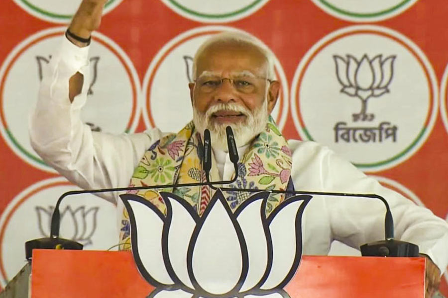 A BJP supporter holds a cutout of Narendra Modi at the Prime Minister’s Palamu rally in Jharkhand on Saturday. 