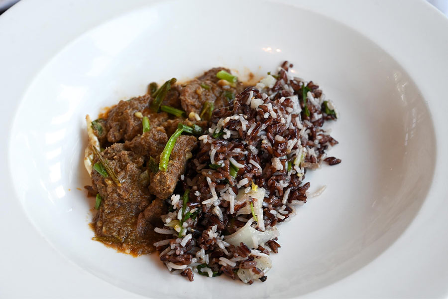 Steamed black and white rice with braised lamb