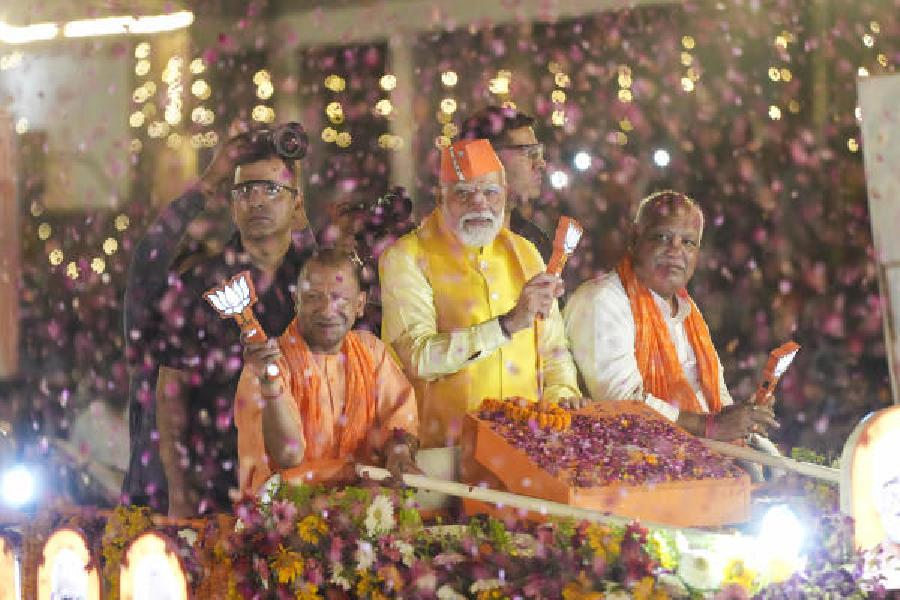 Prime Minister Narendra Modi with chief minister Adityanath during a road show in Ayodhya on Sunday