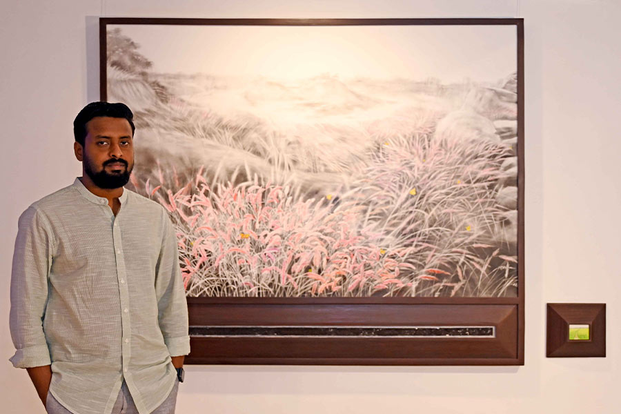 Suman Chandra with his work, Land-escape, charcoal, acrylic, coal dust and watercolour on Italian linen, (large frame 60 x 72 inches, small frame 2.5 x 3.5 inches), 2024
