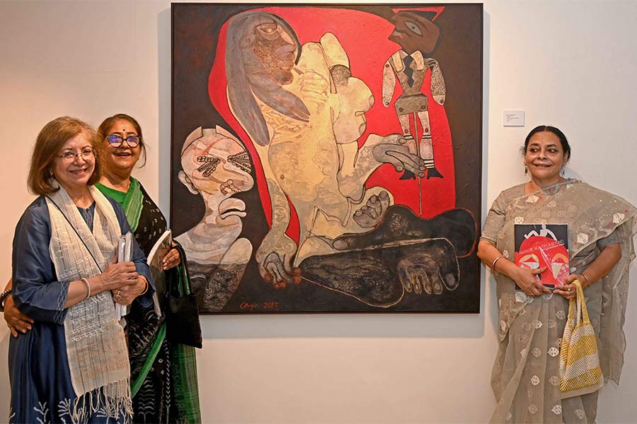 Rakhi Sarkar with artists Jaya Ganguly and Shreyasi Chatterjee, both of whom are exhibiting at the 30th anniversary show. In the frame is visible Ganguly’s untitled work (mixed media on canvas, 54 x 54 inches, 2023)