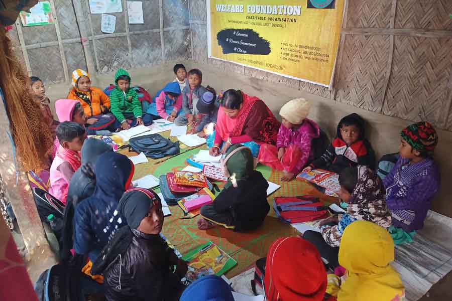 Young students attend a class at Sopan Welfare Foundation in Sarberia in winter.