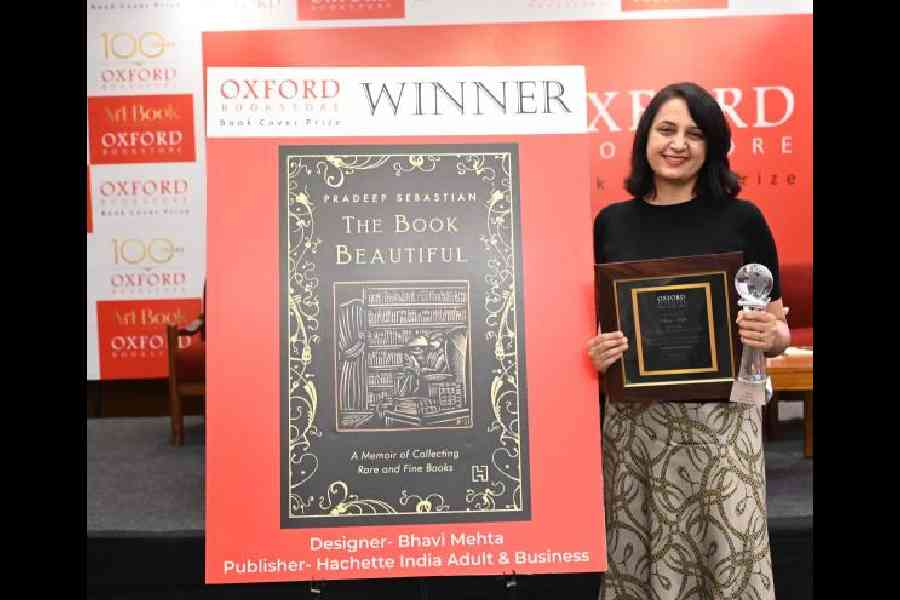Bhavi Mehta poses with her book cover at the award ceremony held in Delhi