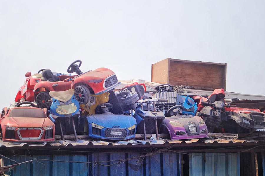 Toy cars await recycling at the warehouse