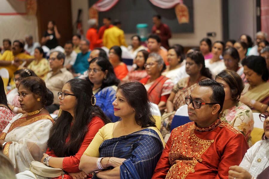 The audience watch the adda session and the performances in rapt attention.