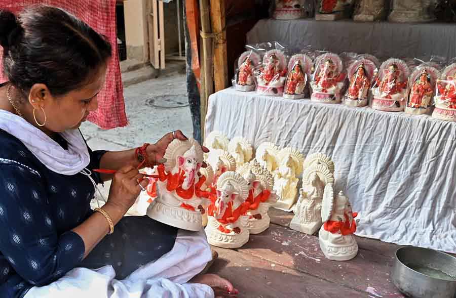 A Kumartuli artisan lends finishing touches to idols of Lord Ganesh ahead of Akshay Tritiya, which falls on May 10 this year