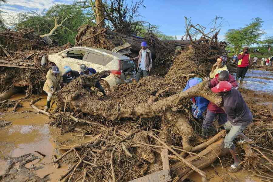 People try to clear the area after a river broke through a blocked tunnel causing floodwaters in the Mai Mahiu area of Nakuru County, Kenya, Monday, April 29, 2024. AP/PTI(AP0