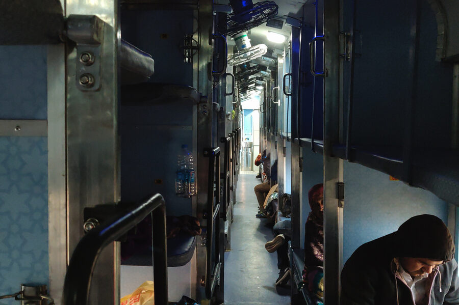 Toddlers are tucked into available spaces, lights are turned off, the baggage counted one last time for the day — there is a routine to the end of the day on the train