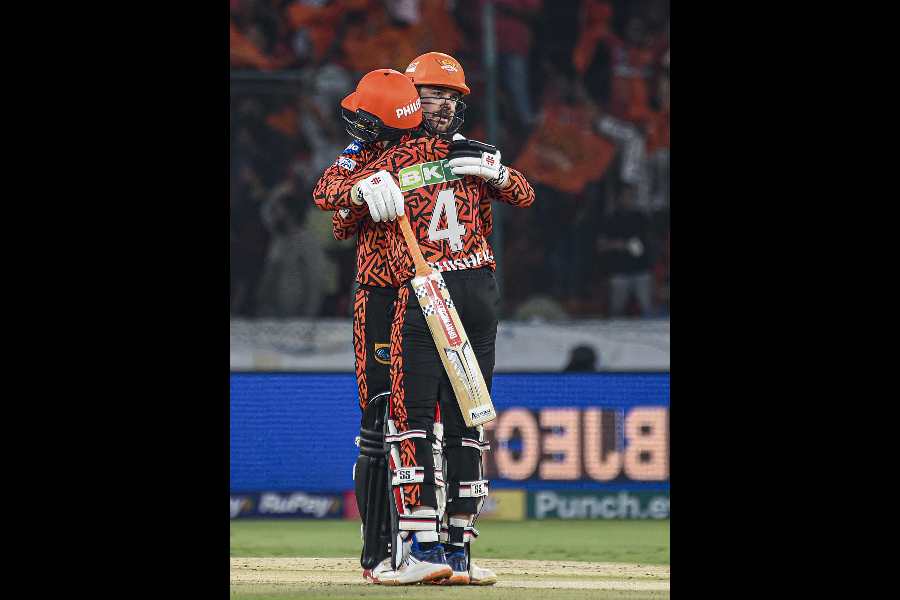 Sunrisers Hyderabad’s Travis Head and Abhishek Sharma celebrate after their thumping victory against Lucknow Super Giants in Hyderabad on Wednesday.