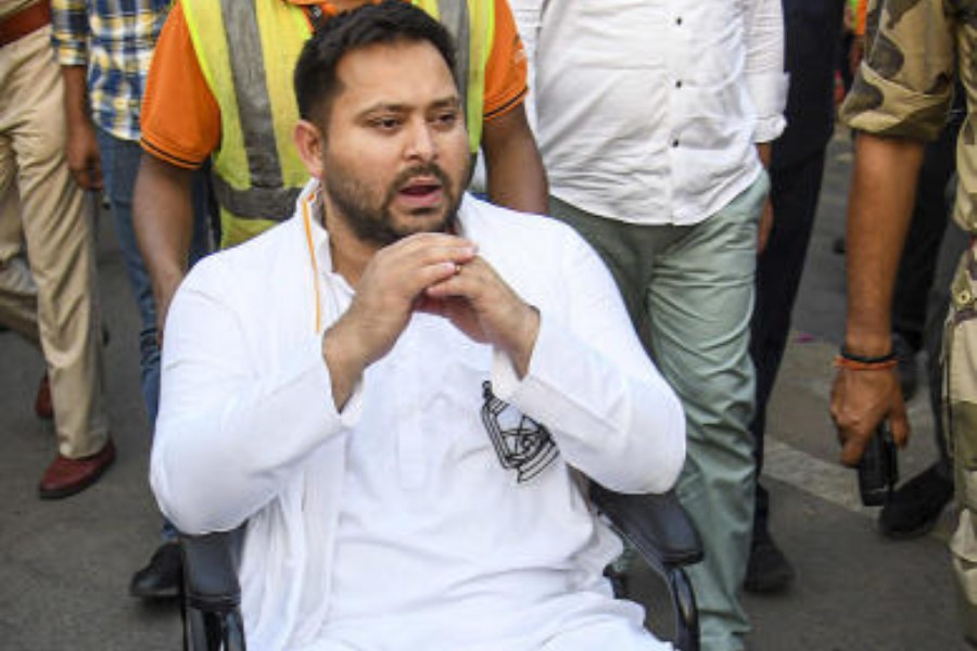 RJD leader Tejashwi Yadav on a wheelchairat Patna airport