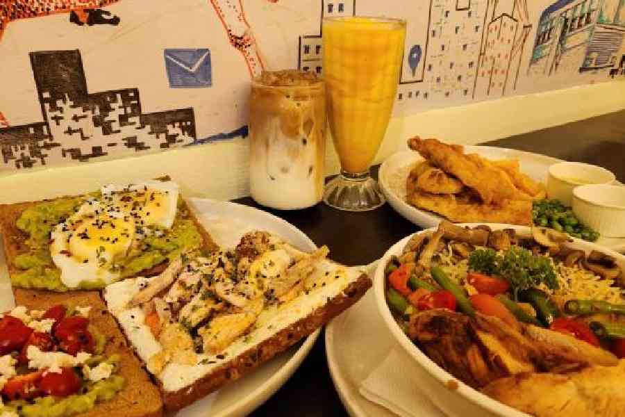 A platter of Open Toasts and an all-day bowl along with Mango Smoothie and Lavender Iced Latte