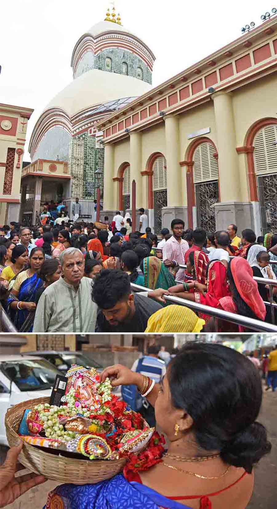 People queue up at Kalighat temple to offer puja and (above) a woman balances an idol of Lord Ganesh and several garlands after performing puja at the temple