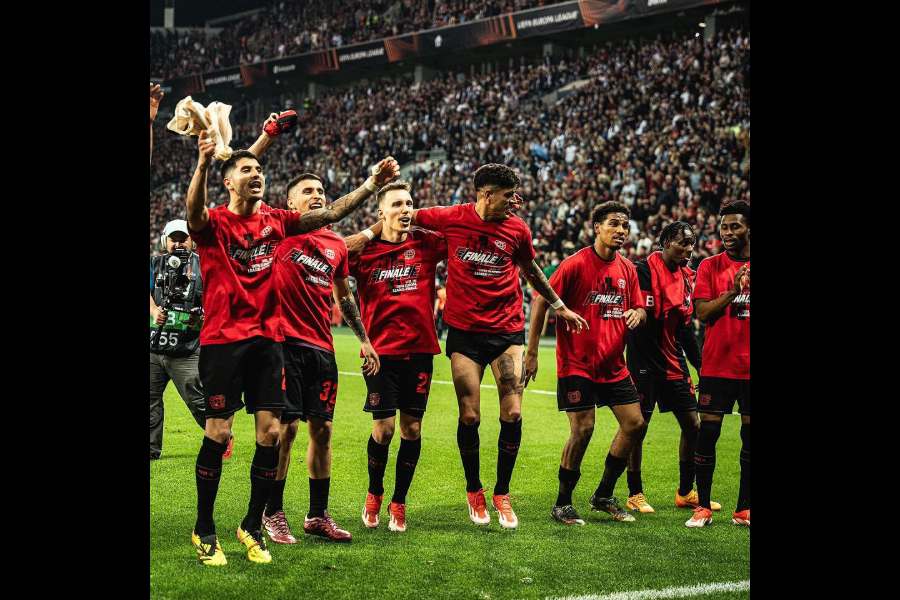 Bayer Leverkusen players celebrate after the Europa League semi-final second-leg game against AS Roma in Leverkusen on Thursday.