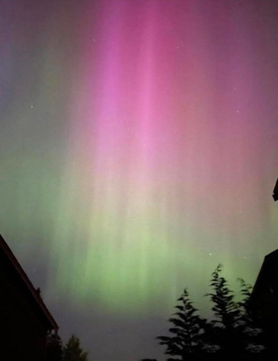 Gargi Roy, a voluntary research assistant in London, also captured a bicoloured sky of green and pink from central London at 11pm to send to her parents in Kolkata